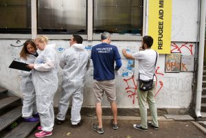 volunteers painting building